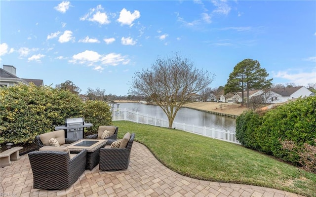 view of patio featuring a water view and area for grilling