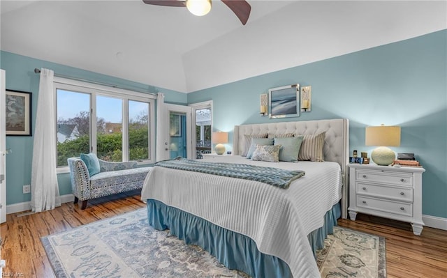 bedroom featuring lofted ceiling, hardwood / wood-style floors, and ceiling fan