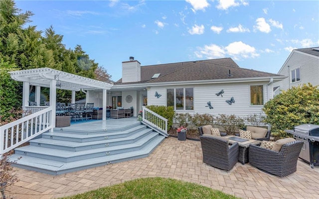 rear view of property featuring an outdoor hangout area, a pergola, and a patio