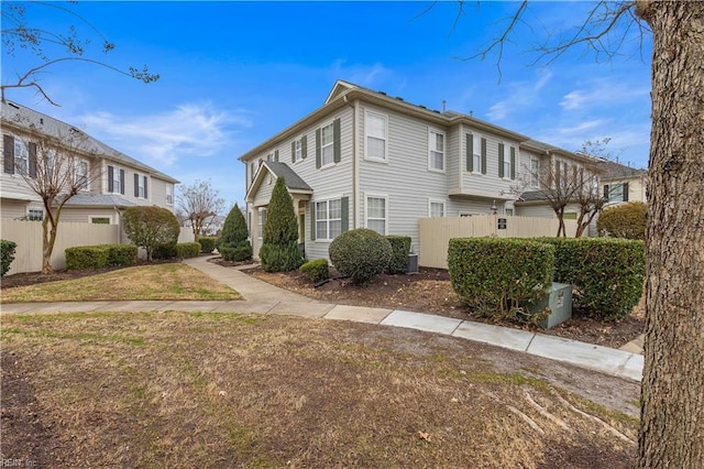 view of side of property with a lawn