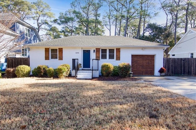 single story home with a garage and a front yard