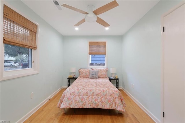 bedroom featuring hardwood / wood-style floors and ceiling fan