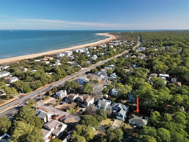 bird's eye view with a water view and a beach view