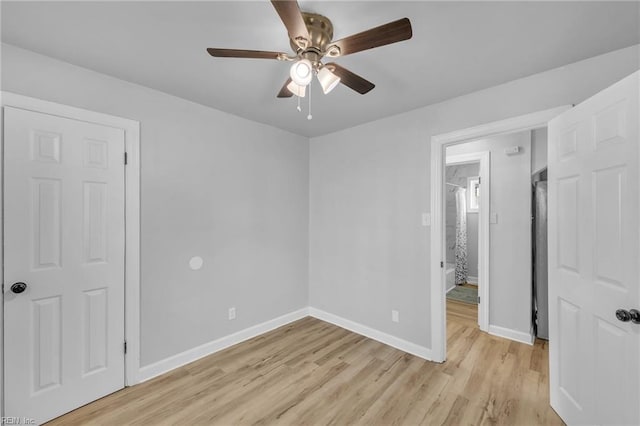 unfurnished bedroom with ceiling fan and light wood-type flooring