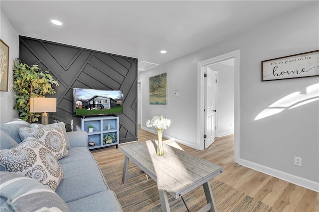 living room with light hardwood / wood-style flooring