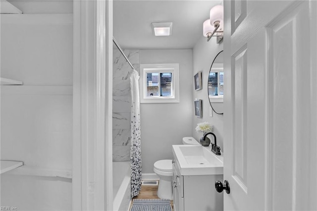 full bathroom featuring vanity, hardwood / wood-style flooring, toilet, and shower / bathtub combination with curtain