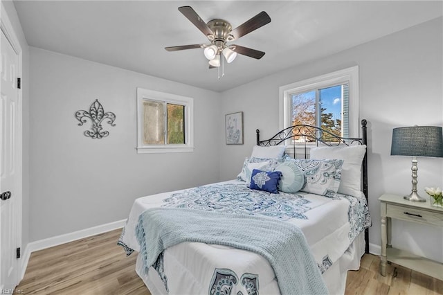 bedroom featuring ceiling fan and light hardwood / wood-style flooring