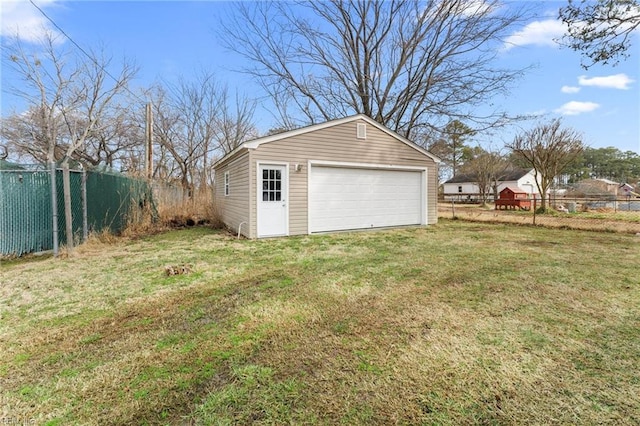 garage featuring a lawn