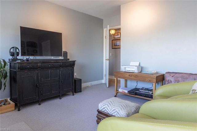 living room with baseboards and light colored carpet