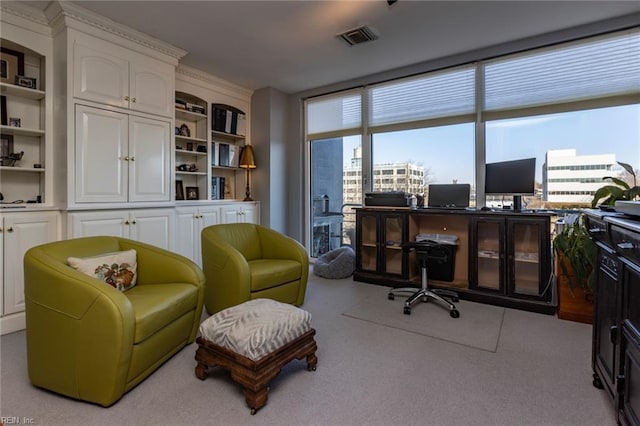 office space featuring visible vents and light colored carpet