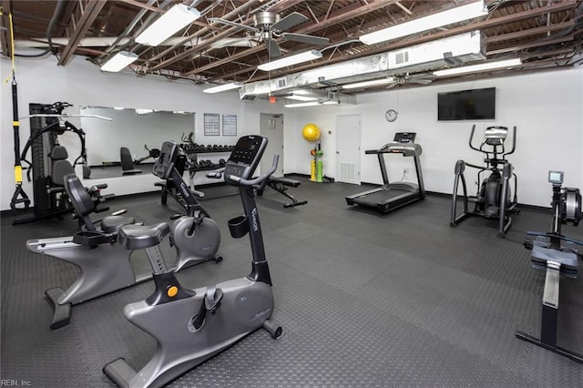 exercise room featuring baseboards