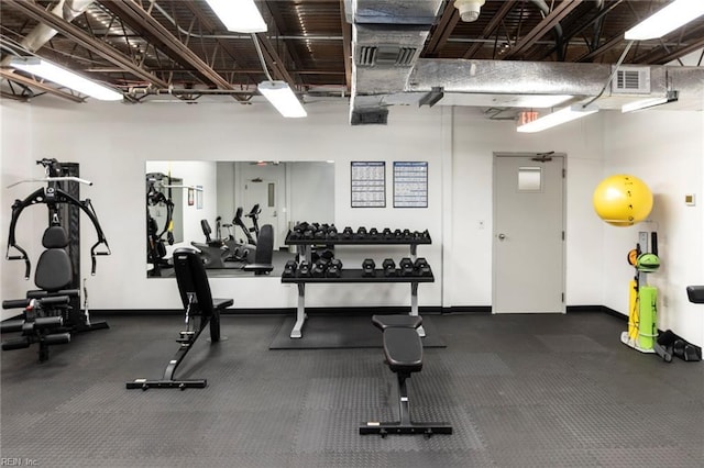 workout area with visible vents and baseboards