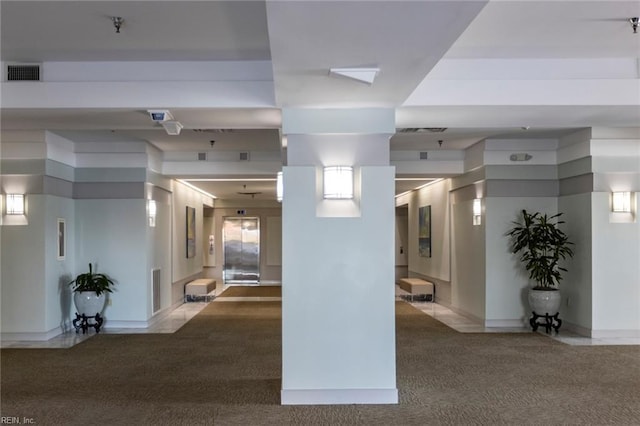 corridor with carpet flooring and visible vents