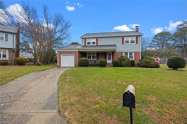 view of front of property with a garage and a front lawn