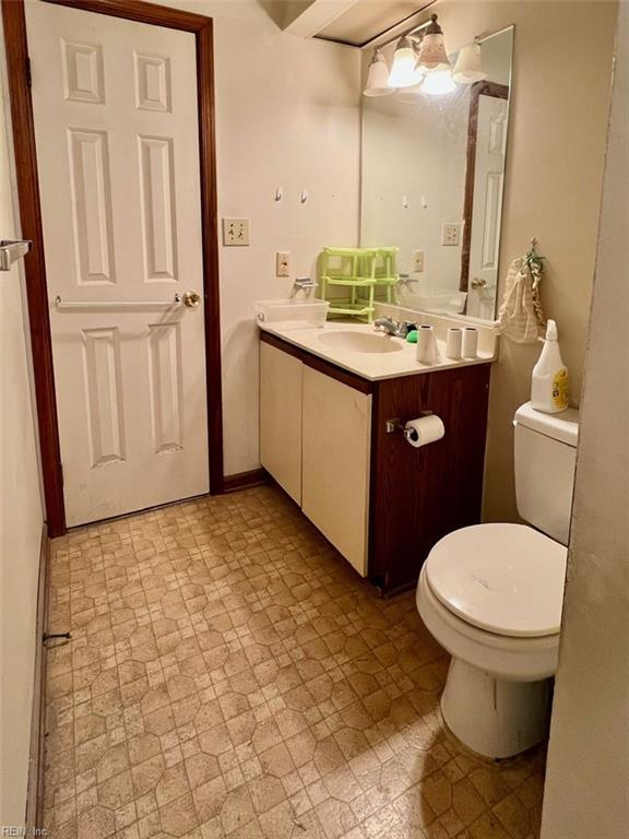 bathroom featuring vanity and toilet