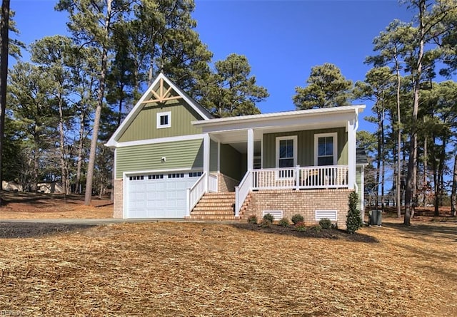 view of front of home with a garage and covered porch