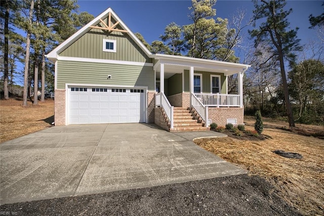 view of front of house featuring a porch and a garage