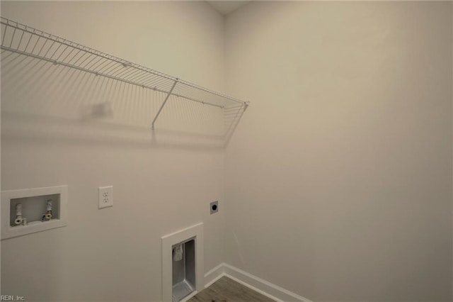 laundry room featuring hardwood / wood-style flooring, washer hookup, and hookup for an electric dryer