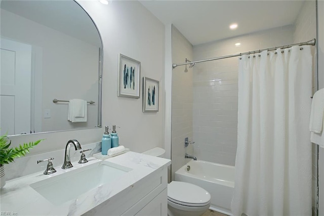 full bathroom featuring vanity, toilet, and shower / tub combo