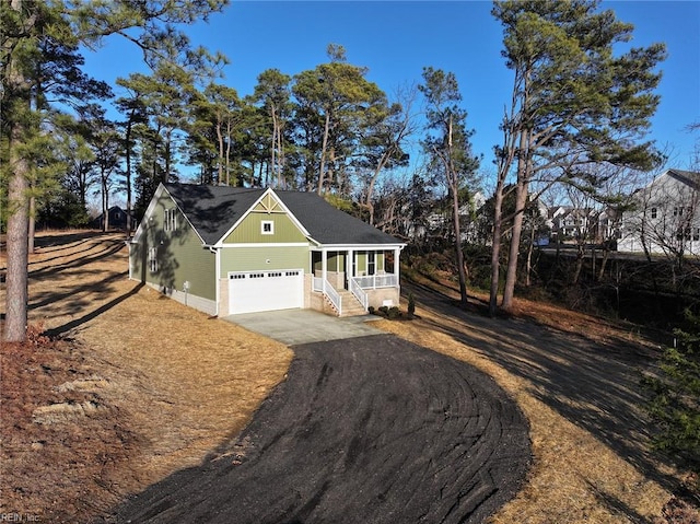 view of front facade featuring a garage and a porch