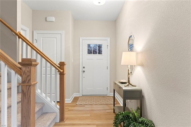 entryway with light hardwood / wood-style floors