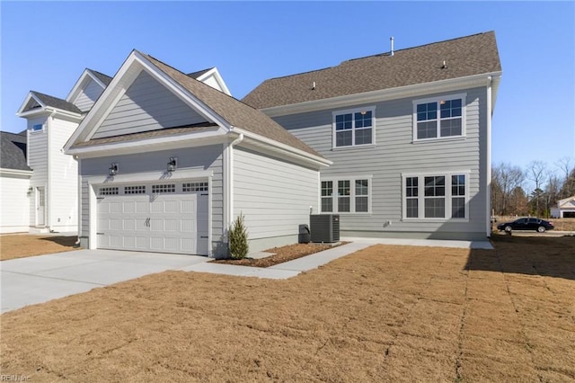 exterior space featuring central AC and a garage