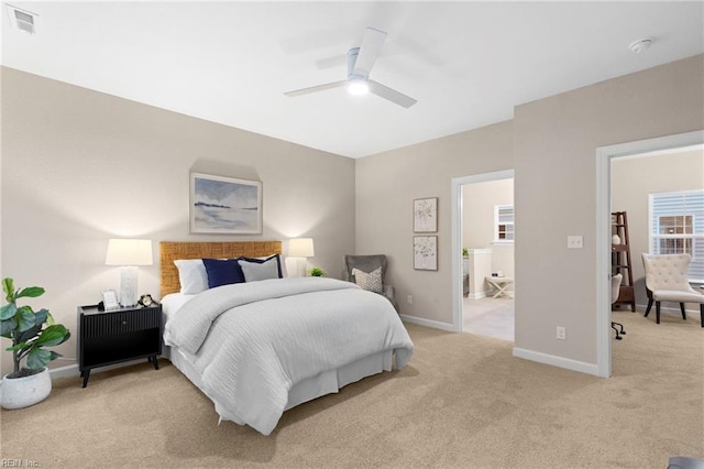 bedroom with ceiling fan and light colored carpet