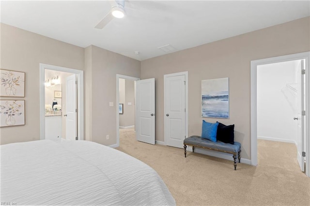 carpeted bedroom with connected bathroom and ceiling fan