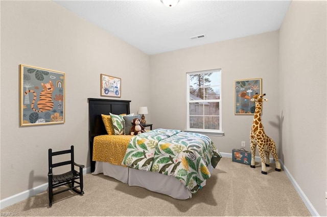 bedroom featuring light colored carpet