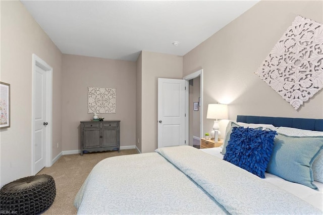 bedroom with light colored carpet