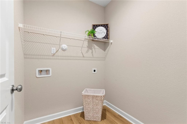 laundry room with hookup for a washing machine, hardwood / wood-style floors, and electric dryer hookup