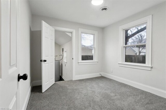 428 Hampton Roads Ave, Hampton, VA 23661 - unfurnished bedroom featuring multiple windows and carpet