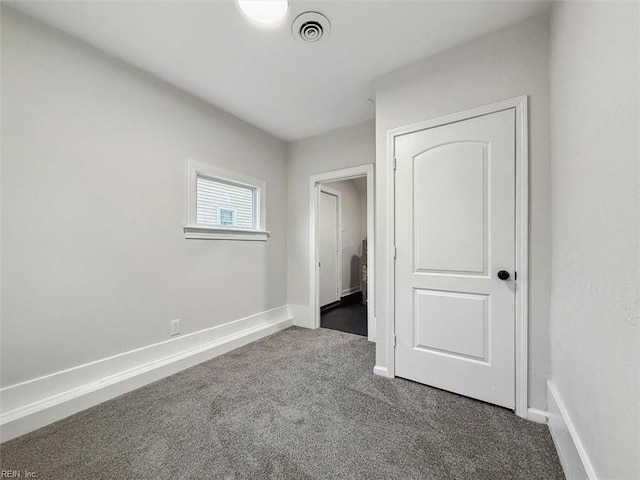 428 Hampton Roads Ave, Hampton, VA 23661 - unfurnished bedroom with dark colored carpet