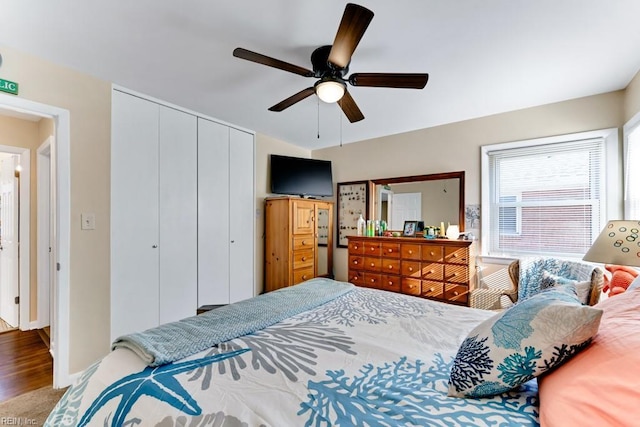 bedroom featuring hardwood / wood-style flooring, a closet, and ceiling fan