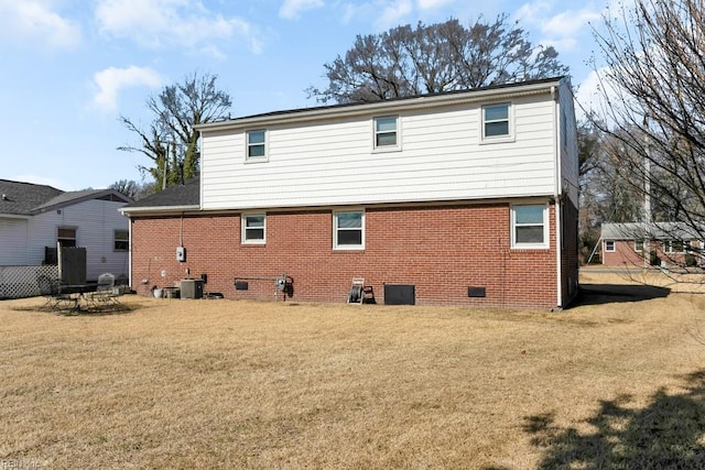 back of house with a lawn