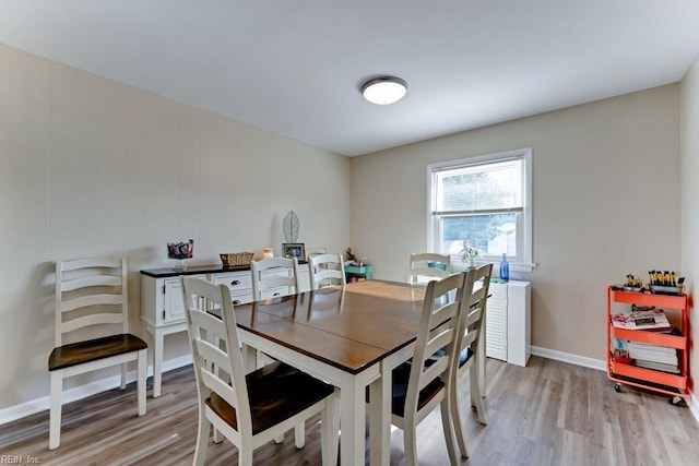 dining space featuring light wood-type flooring