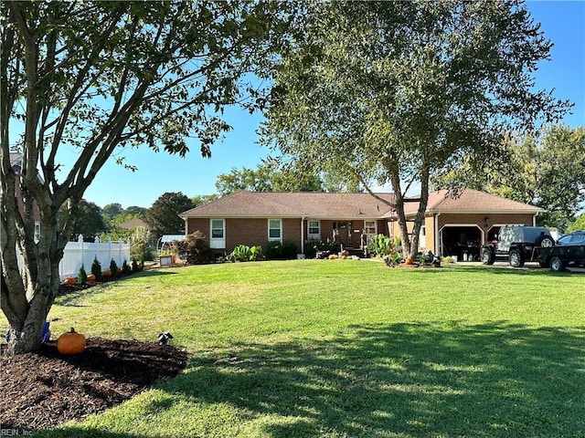 view of front of house with a front yard and a carport