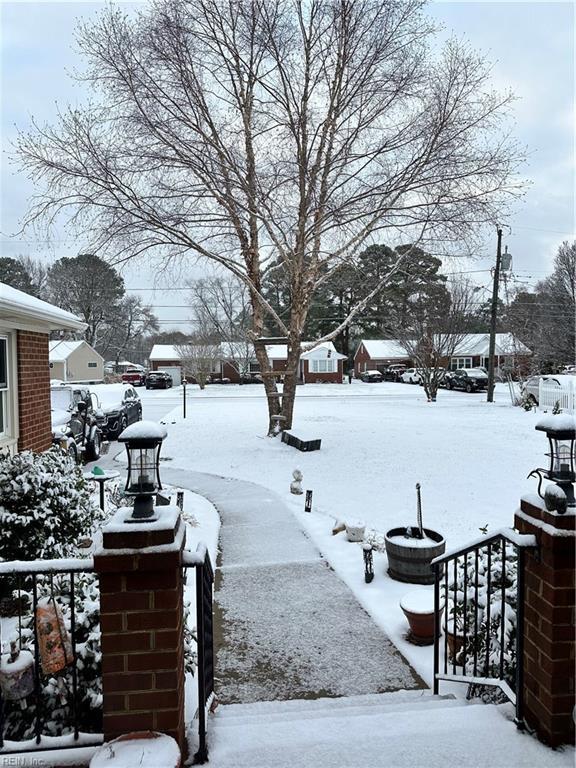 view of yard layered in snow