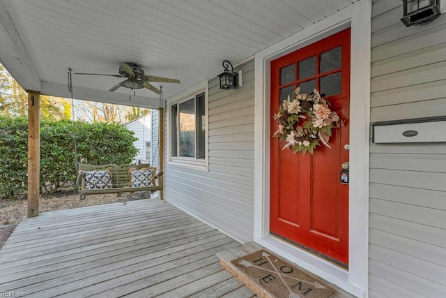 property entrance featuring a porch and ceiling fan