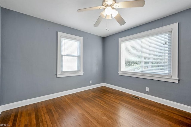 empty room featuring hardwood / wood-style floors and ceiling fan