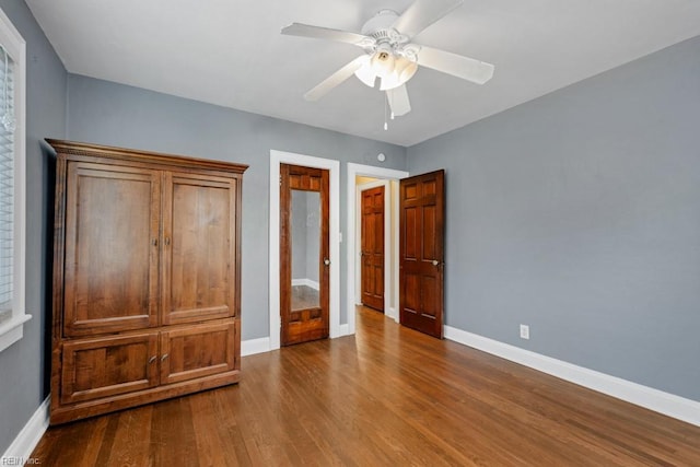 unfurnished bedroom with hardwood / wood-style floors and ceiling fan