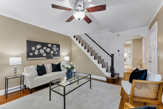 living room featuring hardwood / wood-style flooring and ceiling fan