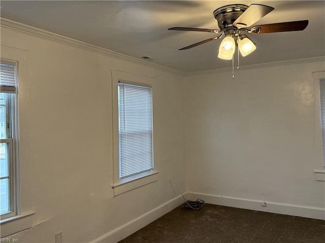 carpeted empty room with ornamental molding and ceiling fan