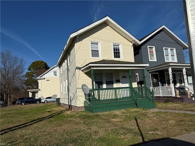 view of front facade with covered porch and a front yard