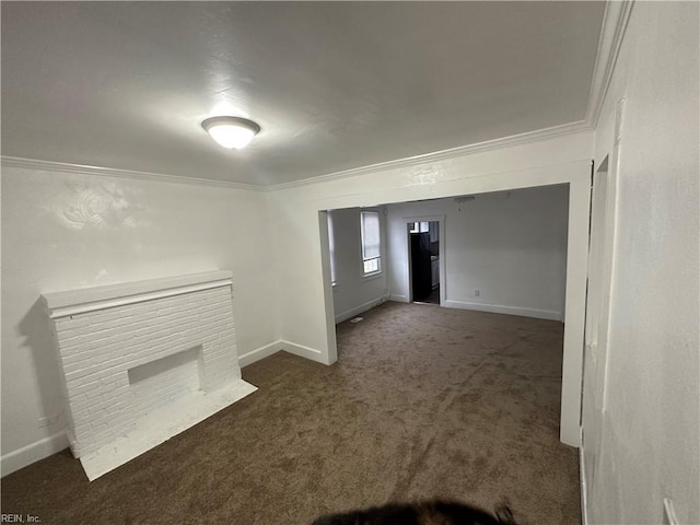 unfurnished living room featuring ornamental molding, a fireplace, and dark carpet