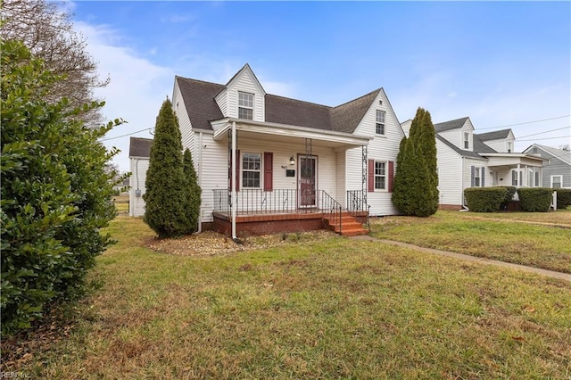 cape cod home featuring a front lawn and a porch