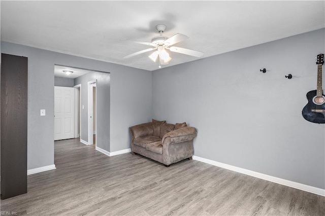 sitting room featuring hardwood / wood-style flooring and ceiling fan