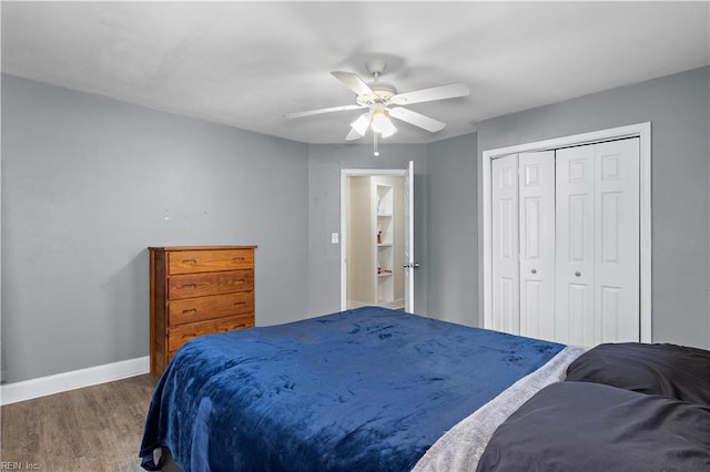 bedroom with hardwood / wood-style floors, a closet, and ceiling fan