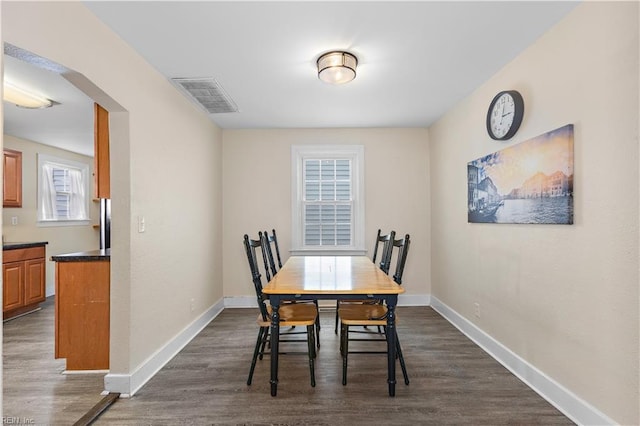 dining room with dark wood-type flooring