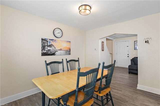 dining area with dark hardwood / wood-style floors